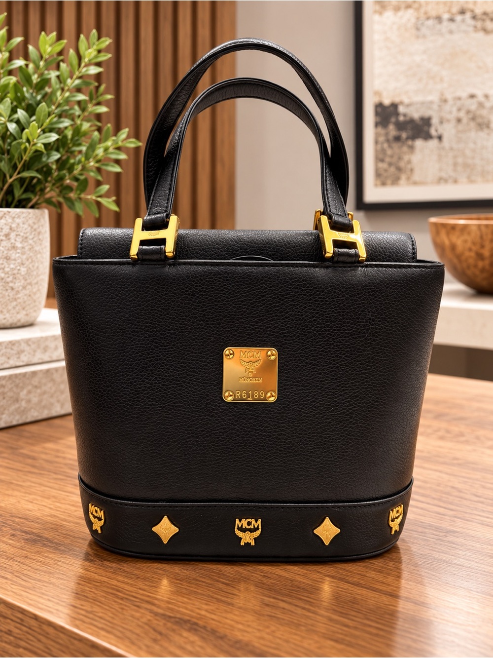 MCM Vintage Black Leather Top Handle Bag with Gold Emblem Accents